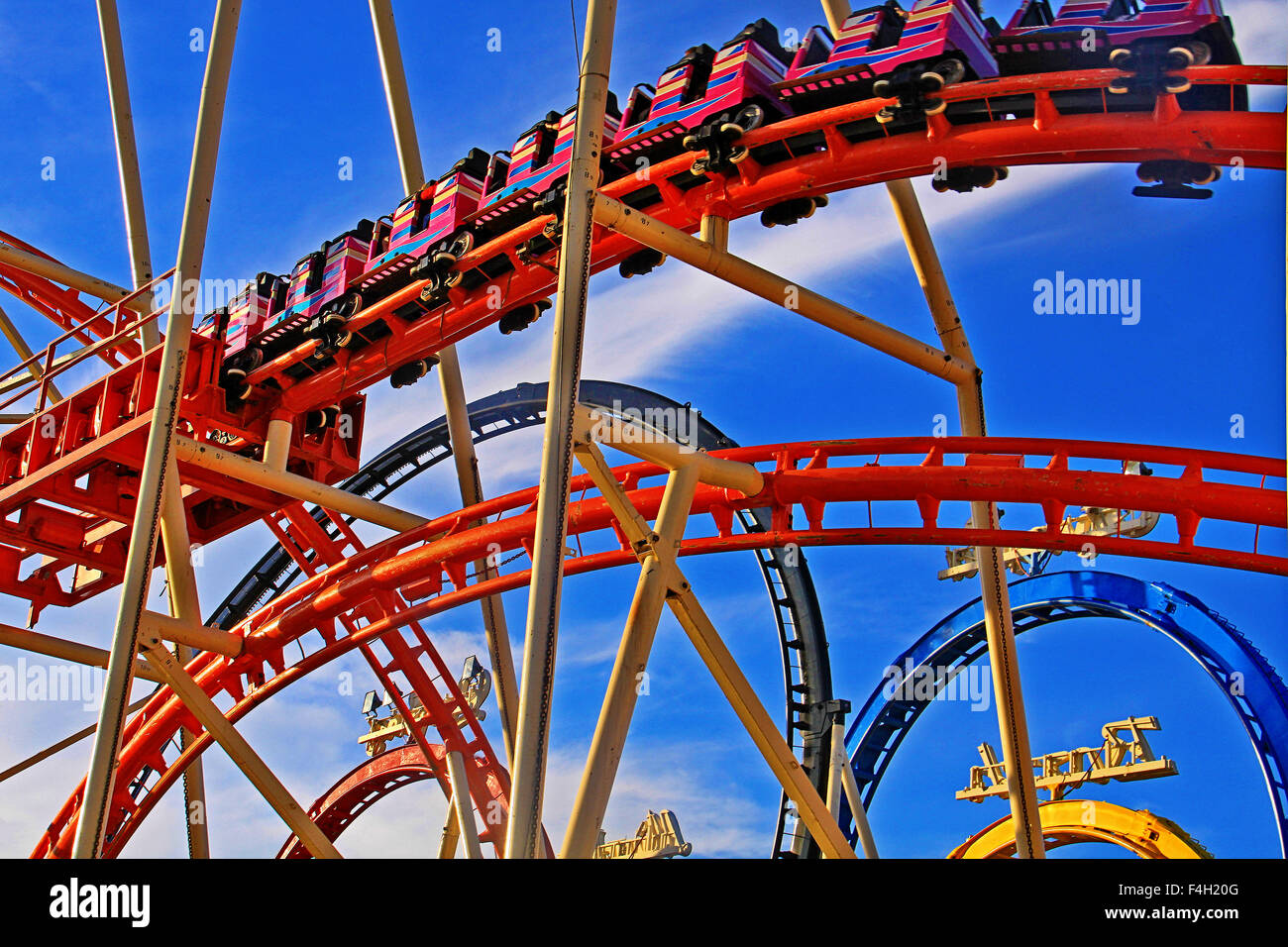 Roller coaster, close up, full enjoyment of the thrill of speed at Oktoberfest in Munich Stock Photo