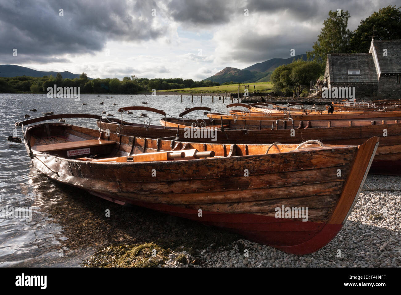 Rowing boats moored near the boathouse at Keswick landing stages, Derwent Water in the English Lake District National Park, Cumbria, England, UK Stock Photo