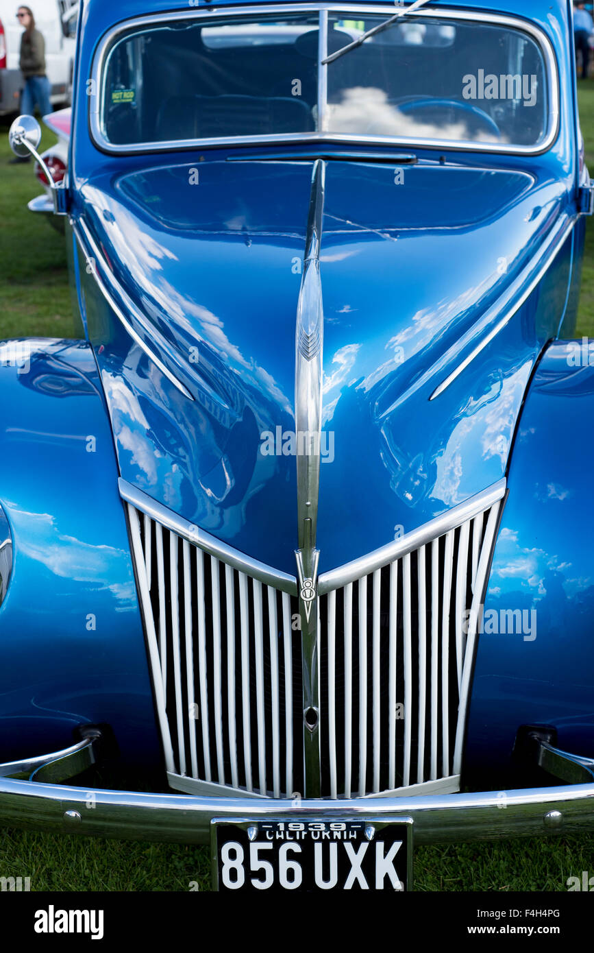 1930 Ford V8, blue, stylish, silver grille, number plate, windscreen, wiper, steering wheel, badge, lines, point, metallic blue Stock Photo