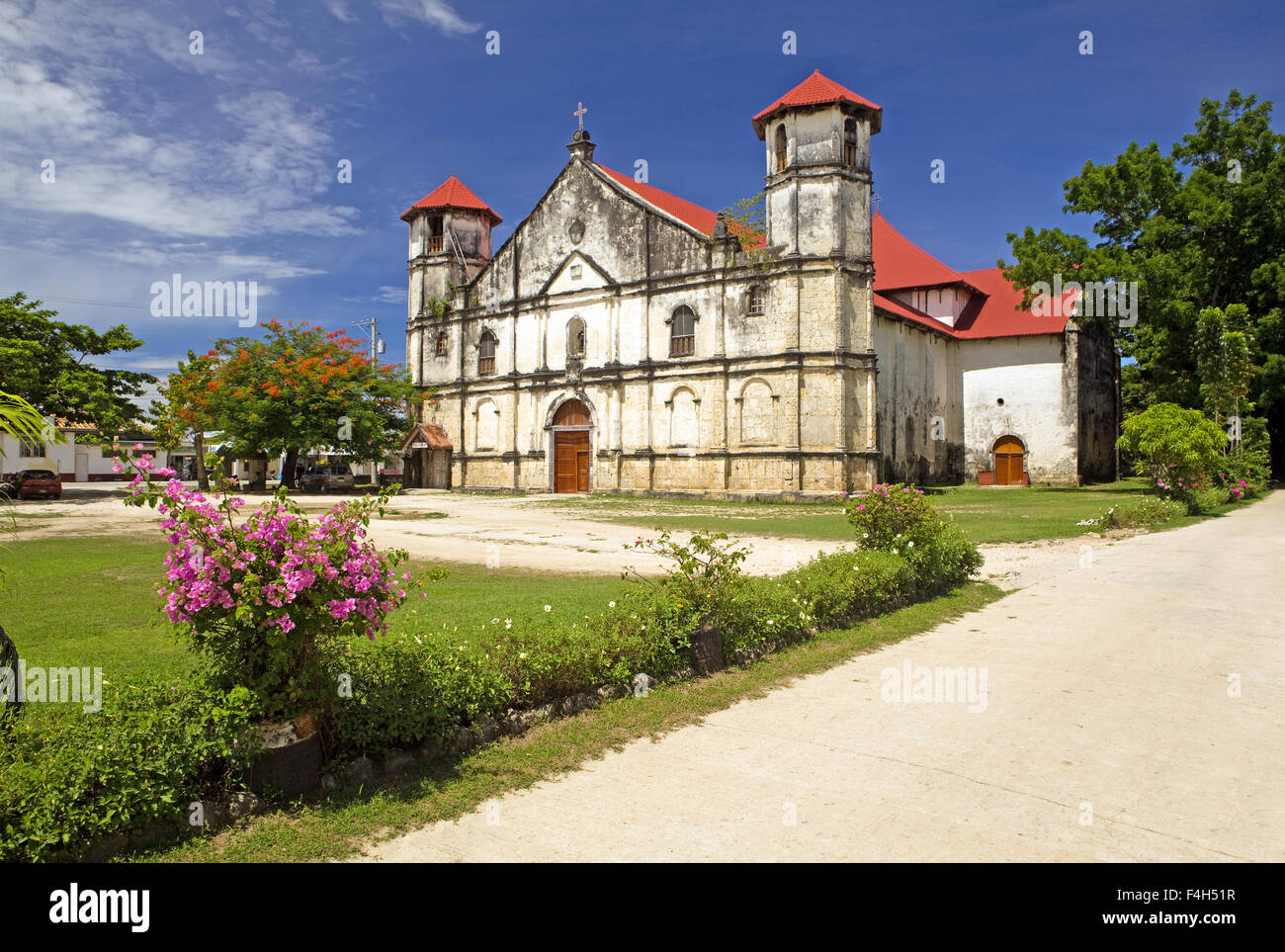 Facade of the San Nicholas Tolentino Catholic Church and courtyard located at Dimiao Town, Bohol Island, Philippines. Stock Photo