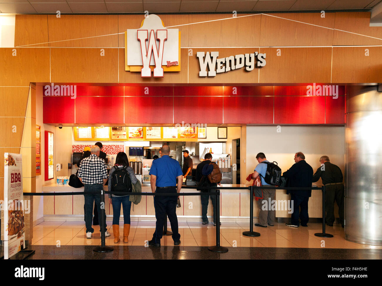 People waiting in a queue, Wendys fast food restaurant outlet, Logan international airport terminal, Boston USA Stock Photo
