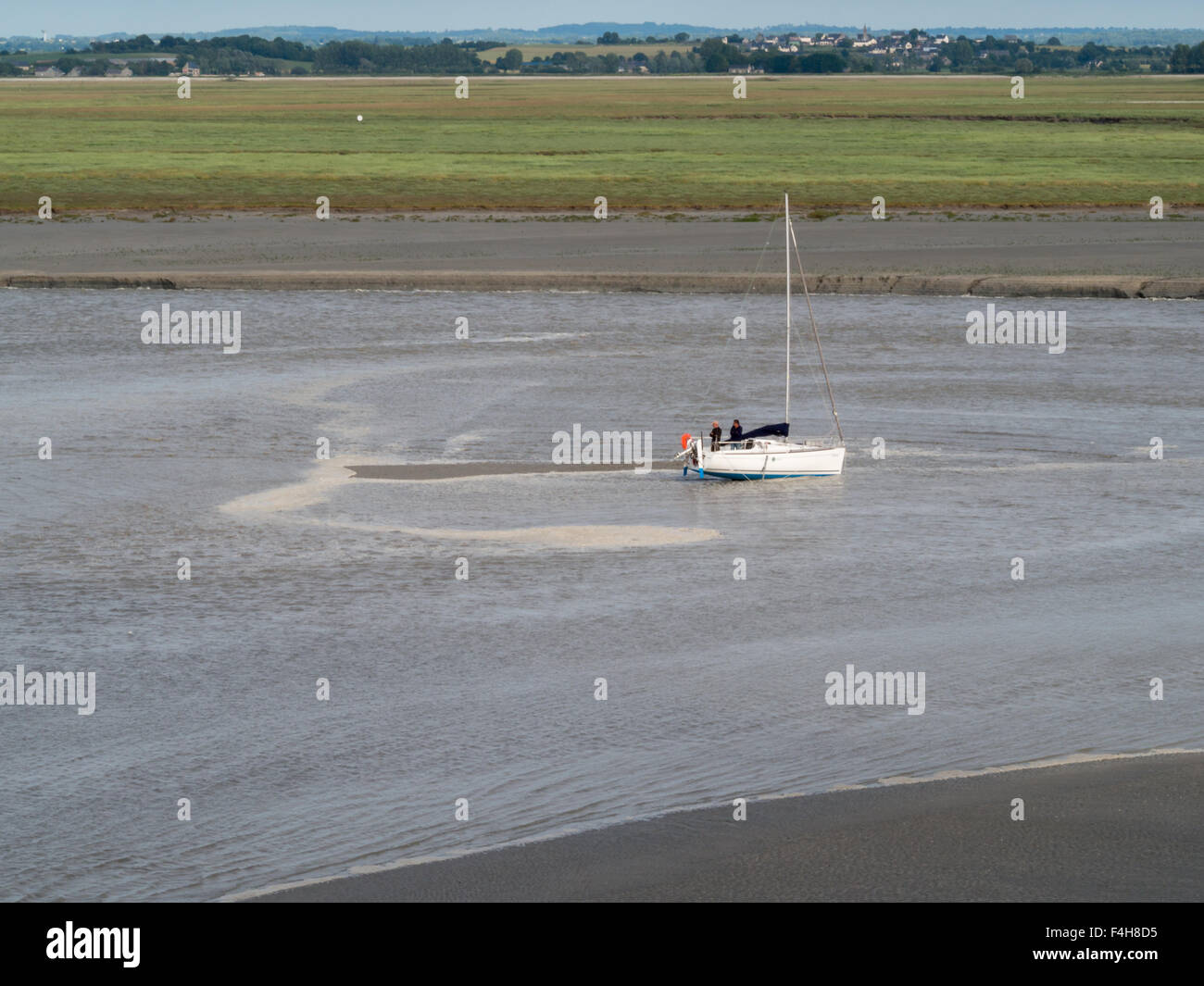 Bogged in the mud of the ow tide around Mont Saint-Michel Stock Photo