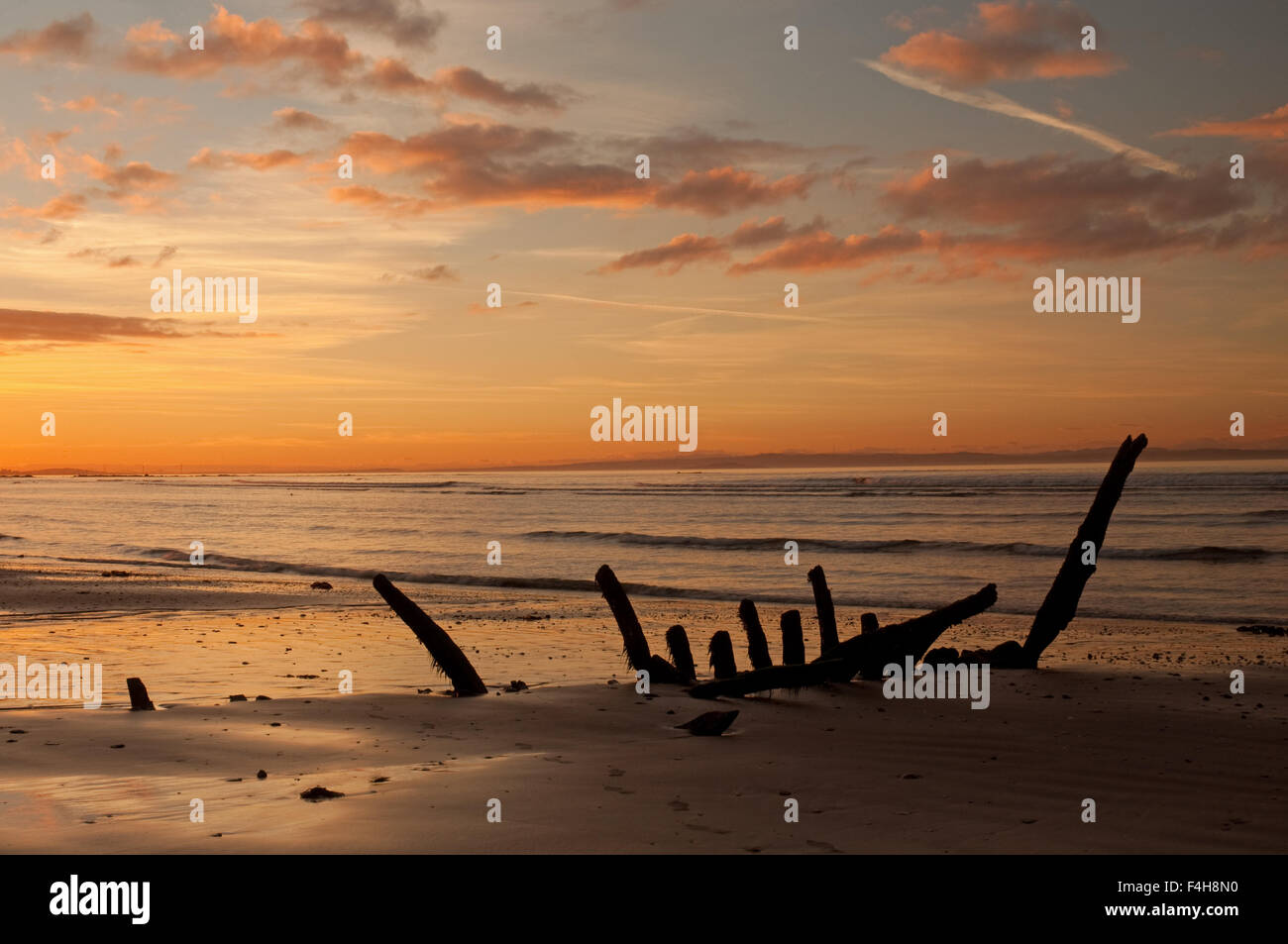 Shipwreck at sunset on Seton Sands Stock Photo - Alamy