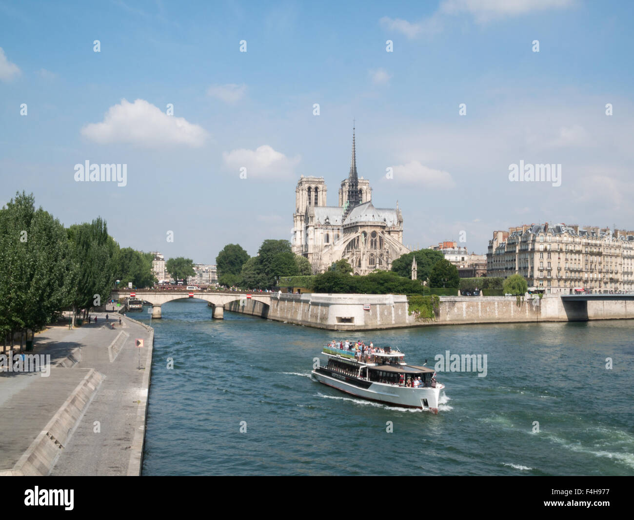 Notre-Dame de Paris and a boat on the Seine river Stock Photo
