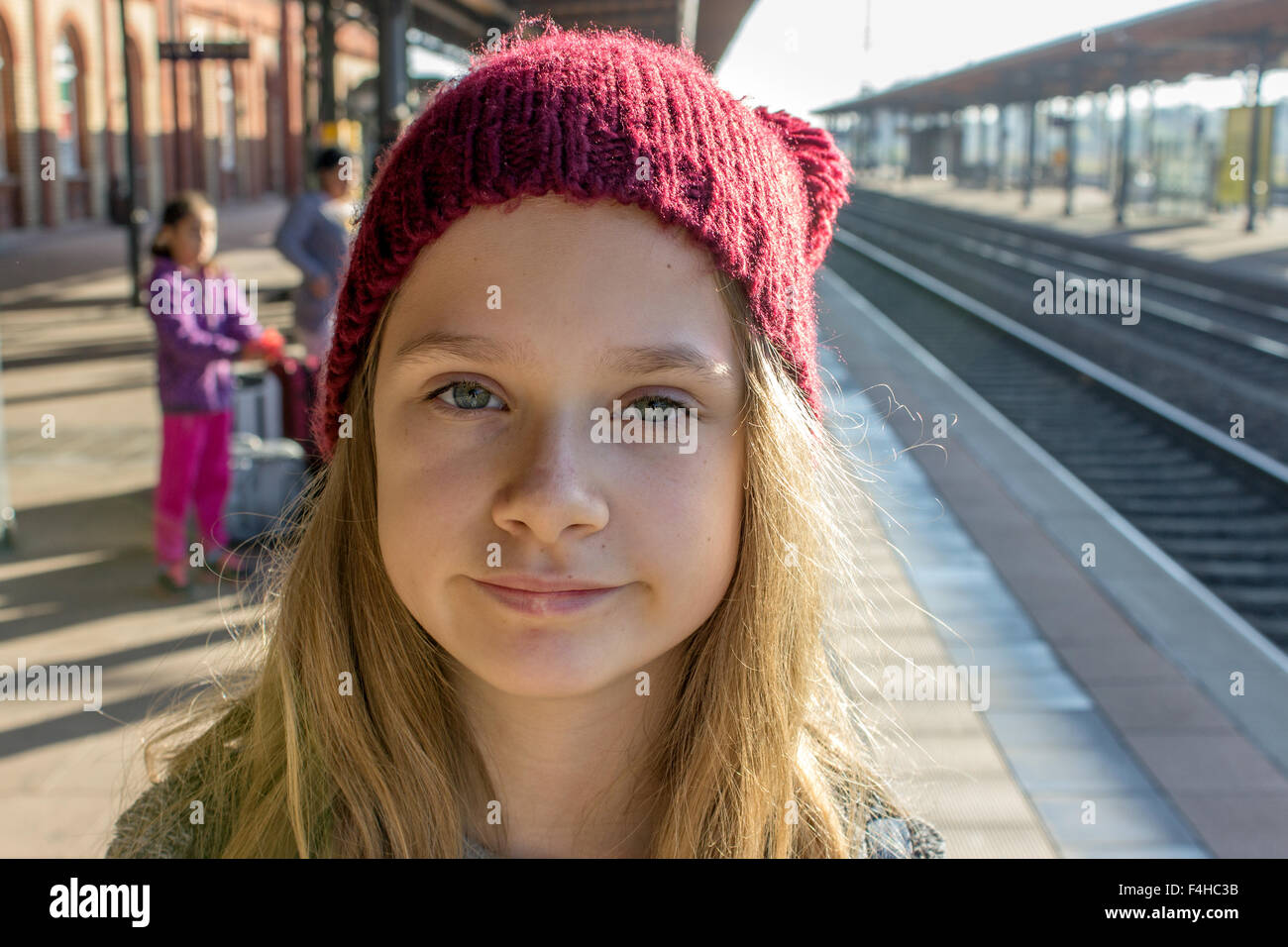 A young girl with long hair at the platform Stock Photo