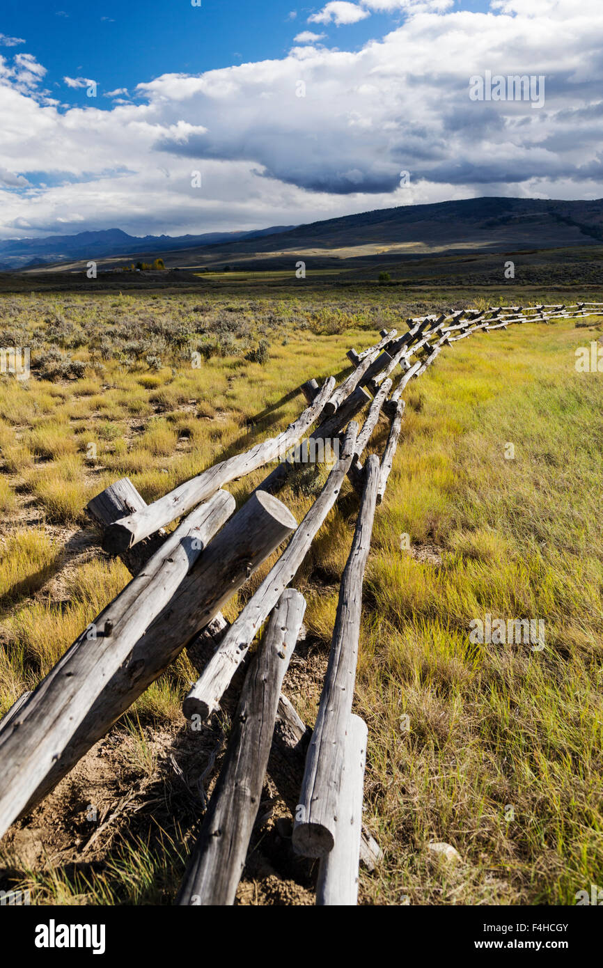Buck & rail fencing; dirt road off Highway 40 and CR14; North Central Colorado; USA Stock Photo