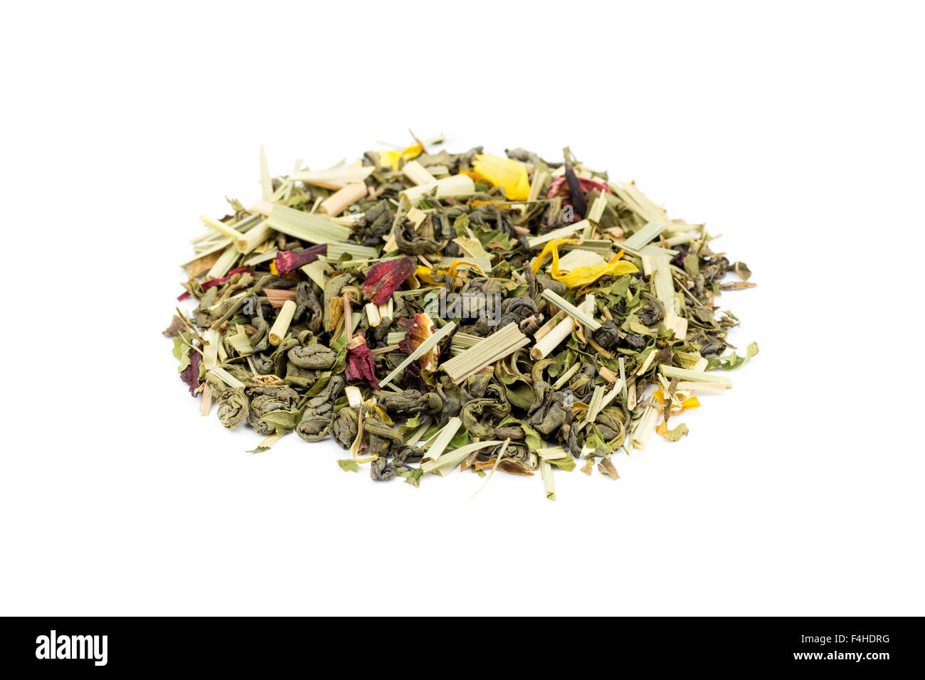 Heap of loose green tea rise and grind isolated on white background Stock Photo