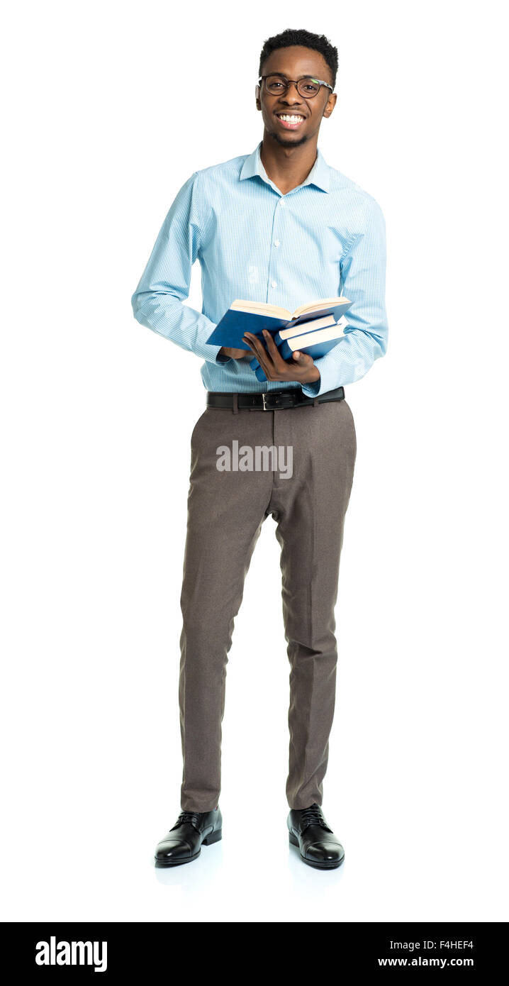 Happy african american college student with books in his hands standing on white background Stock Photo