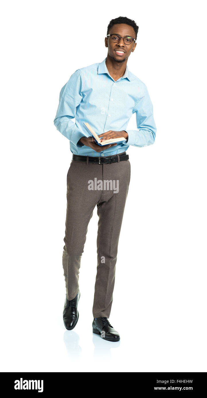 Happy african american college student with books in his hands standing on white background Stock Photo