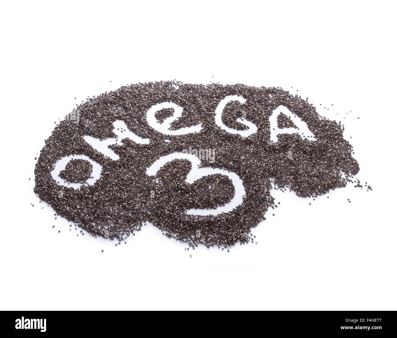 Word OMEGA-3 hand written from chia seeds on white, selective focus. Chia seeds is a source of plant oil of Omega for vegans Stock Photo