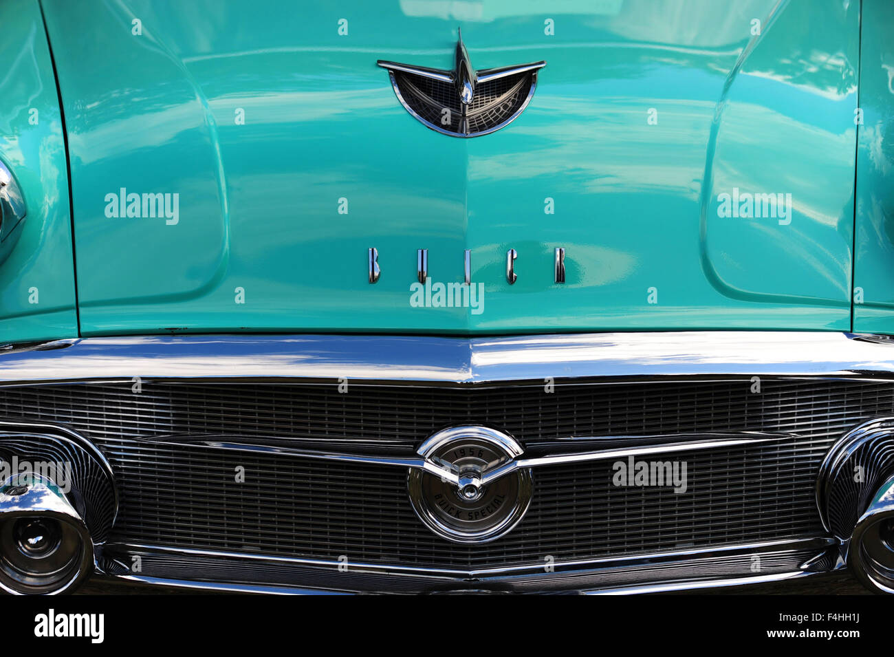 The front end of the 1956 Buick with chrome bumper and hood ornament American made classic car automobile Jet airplane Stock Photo