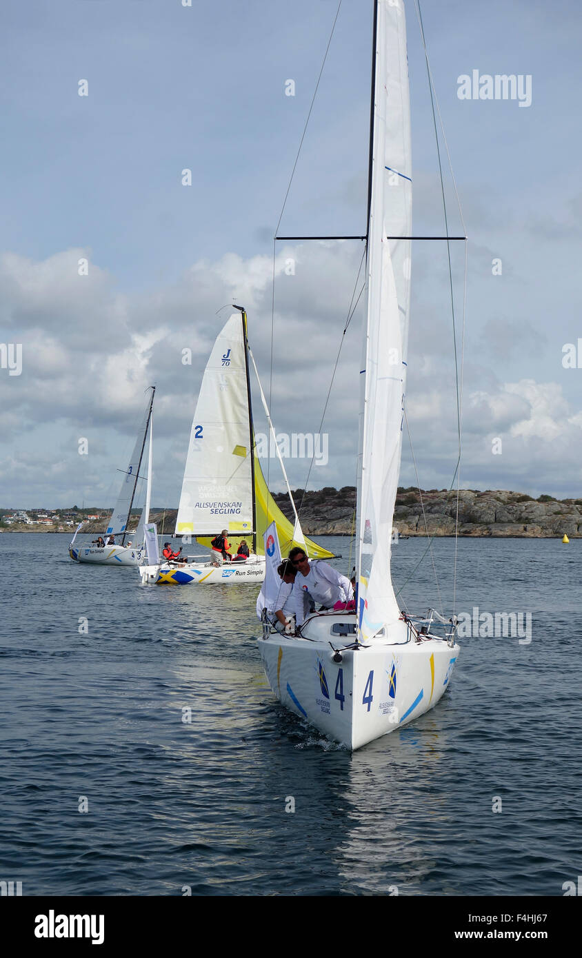Racing sailboat on upwind tack in light breeze J70 class boat on the race during Swedish championship.  Grötö  island in the nor Stock Photo