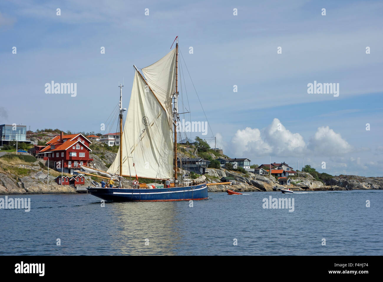 Two masted schooner  sails past by Hjuvik coast on Swedish West coast. Gothenburg, Sweden Stock Photo