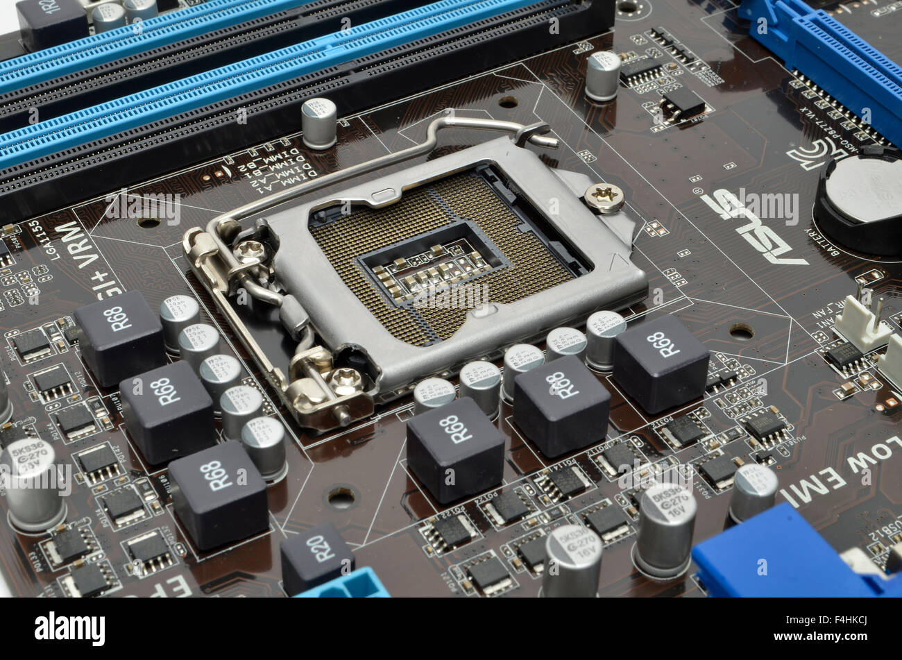 Intel LGA1155 processor socket on an ASUS motherboard. Stock Photo