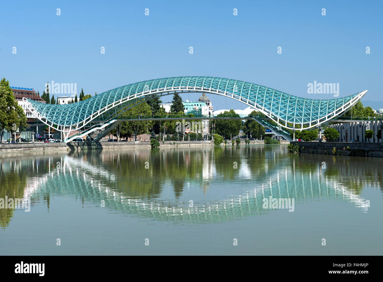 The Bridge of Peace, a pedestrian bridge spanning the Kura / Mtkvari River in Tbilisi, the capital of Georgia. Stock Photo