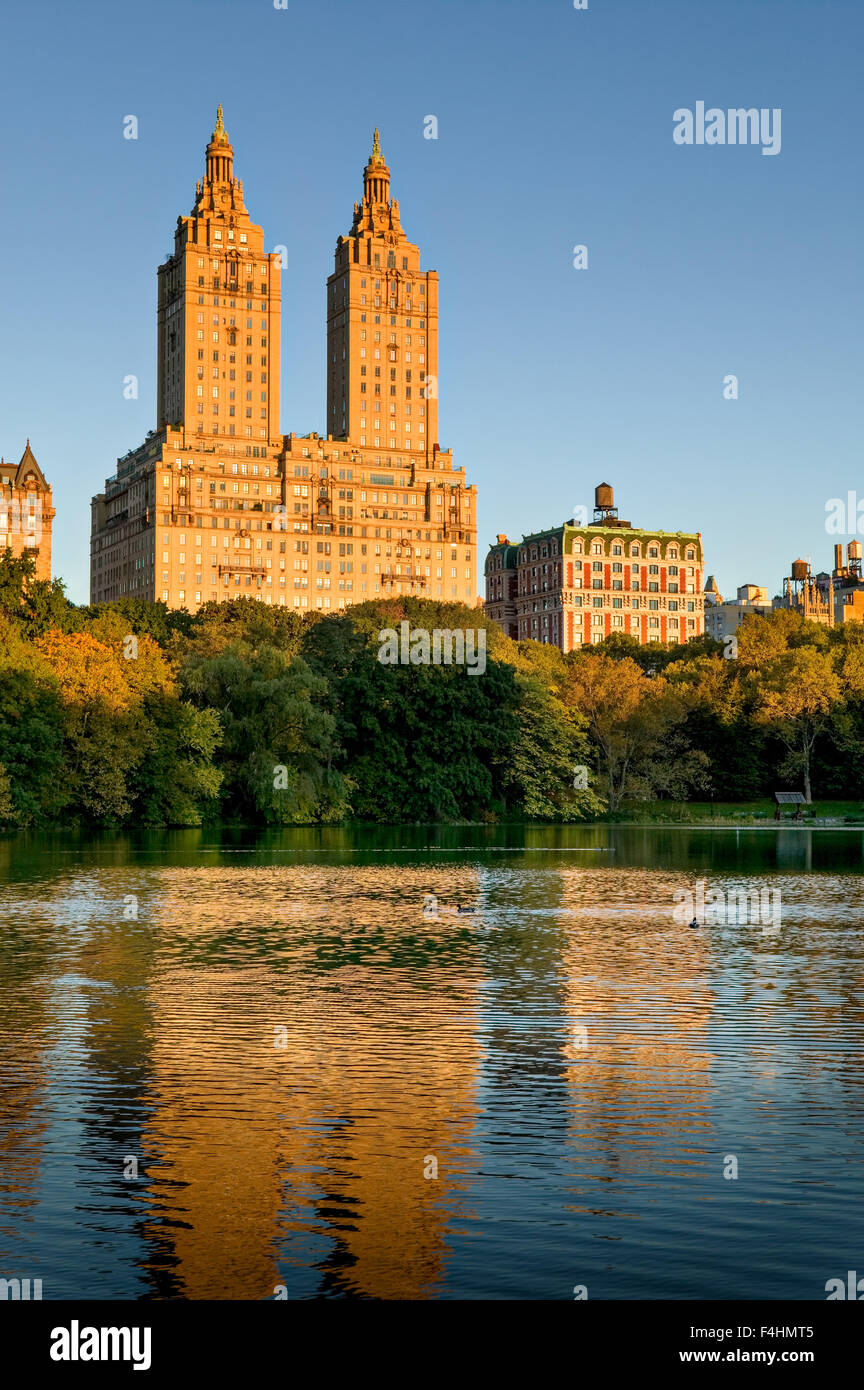 Manhattan Upper West Side across Central Park Lake on Autumn morning ...