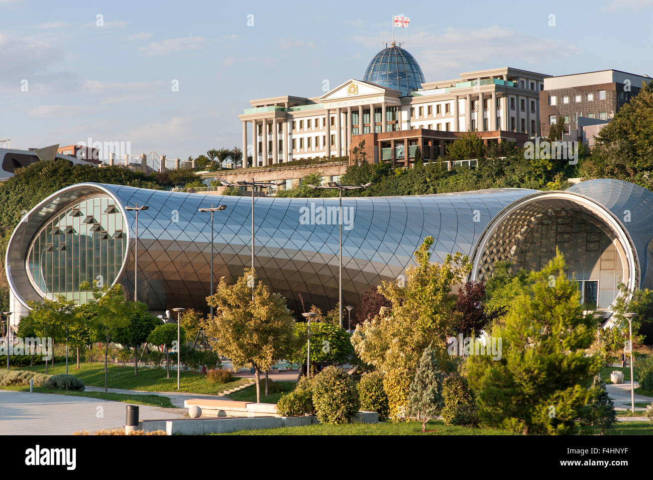 The Rike Park Theater and Exhibition Hall and the Presidential Palace (background) in Tbilisi, the capital of Georgia. Stock Photo