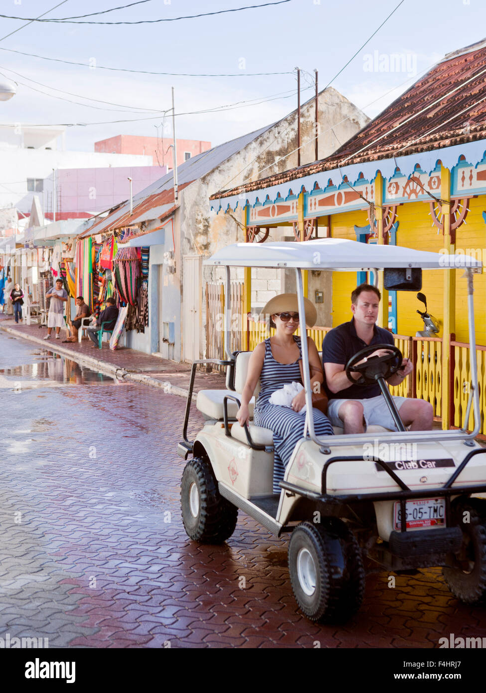 Tourists driving golf carts, Isla Mujeres. Golf carts are the main