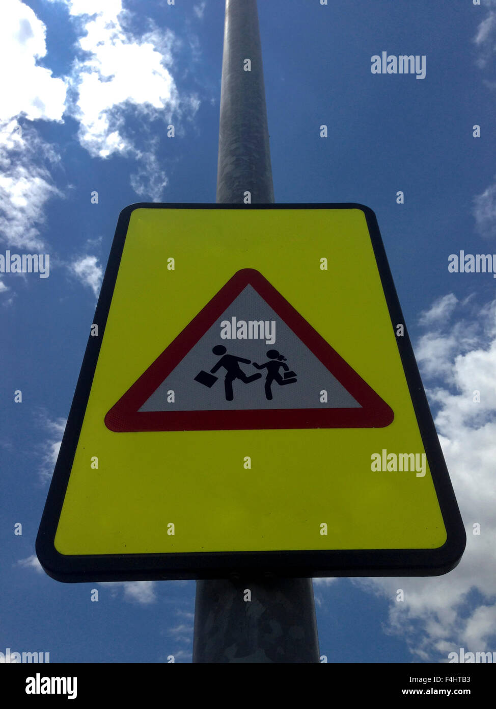 warning school zone traffic sign pole over blue sky Stock Photo