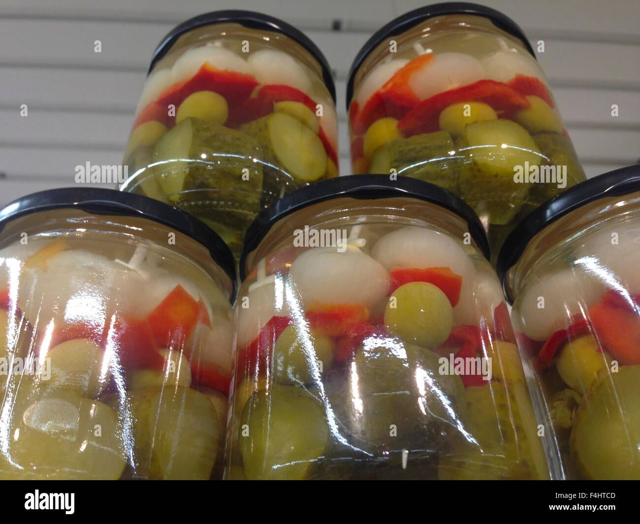 Pile of jars with spanish banderillas, skewers with different pickles