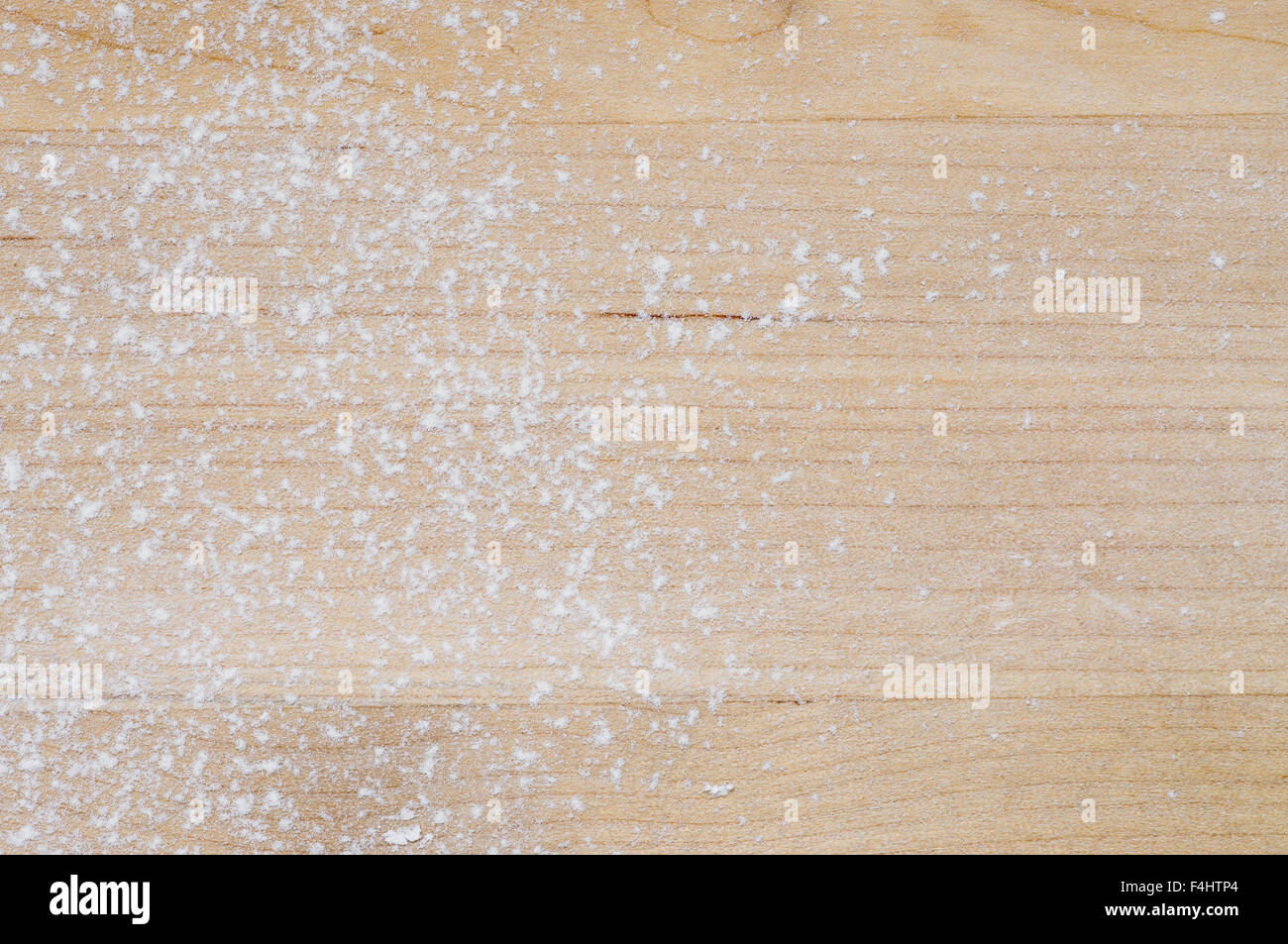 Flour scattered on the wooden board for background Stock Photo
