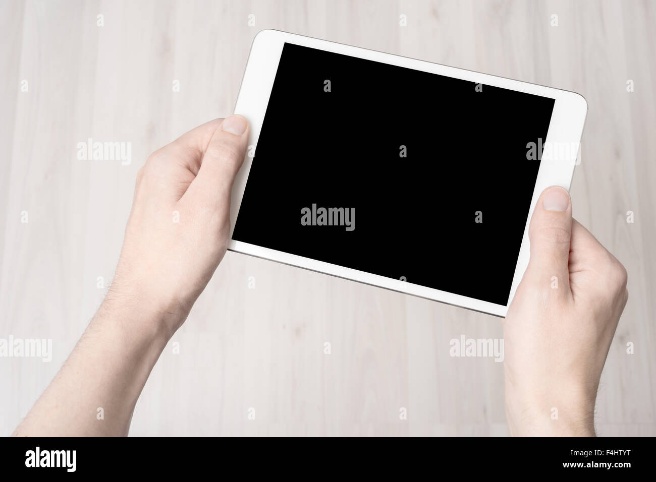 Digital tablet in hand, on a white background, isolated Stock Photo