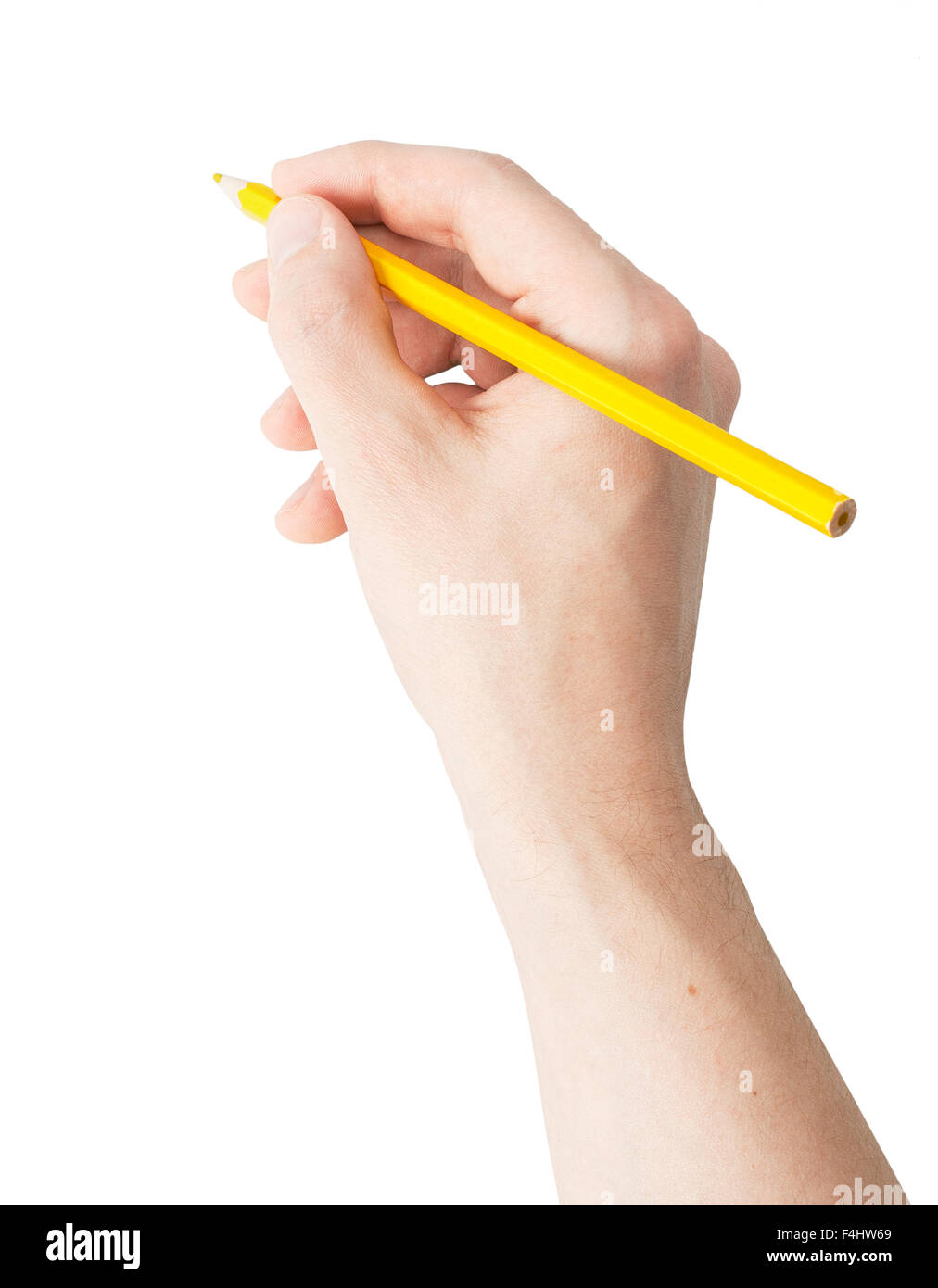 A hand holding a pencil on white background Stock Photo