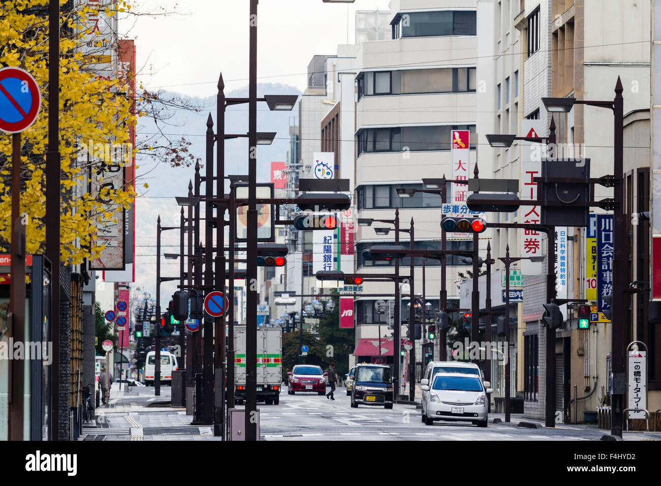 Japan Wakayama Telephoto Shot Of A Four Lane Straight Main Road Through Several Office Blocks Traffic On Road And Many Stop Lights Stock Photo Alamy