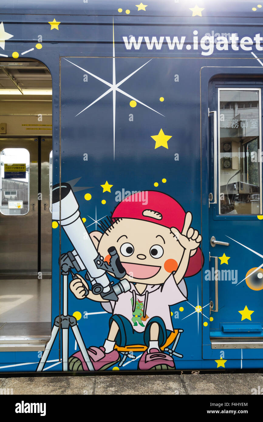 Iga Ueno, Japan. Kintetsu private railway, Iga Tetsudo, Iga Line. Train-carraige decorated with boy astronomer with telescope and wearing baseball cap. Stock Photo