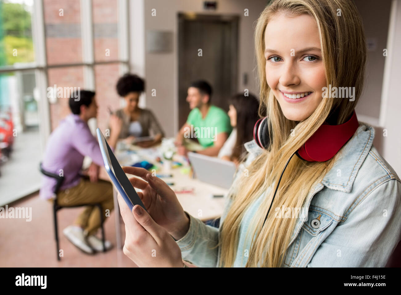 Student working on assignment with tablet Stock Photo - Alamy