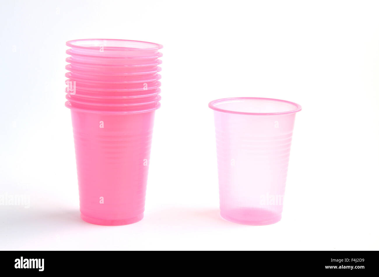 https://c8.alamy.com/comp/F4J2D9/pile-of-pink-plastic-glasses-with-one-detached-beside-F4J2D9.jpg
