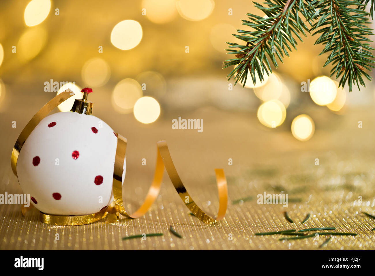 Christmas background with needles and color lights Stock Photo
