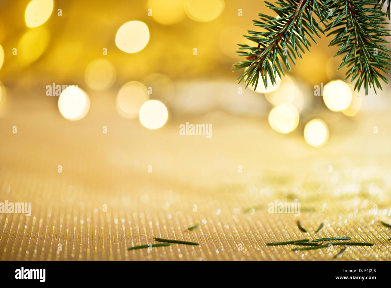 Christmas background with needles and color lights Stock Photo