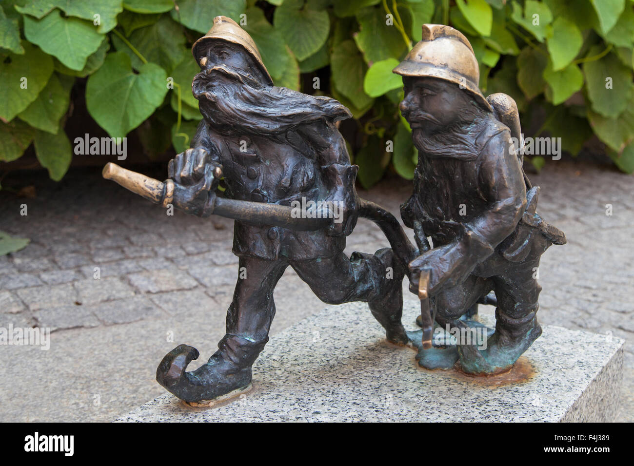 Firemen dwarves on sw Mikolaja street, Wroclaw, Poland. Stock Photo
