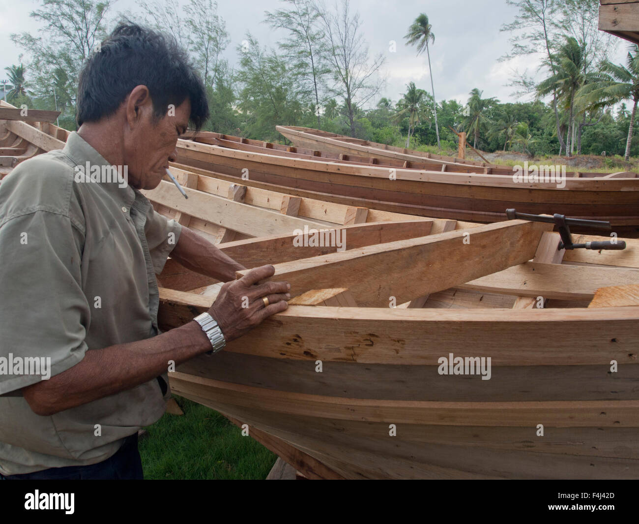Craftsman making a fishing boat on Bintan island, Sumatra, Indonesia, Southeast Asia, Asia Stock Photo