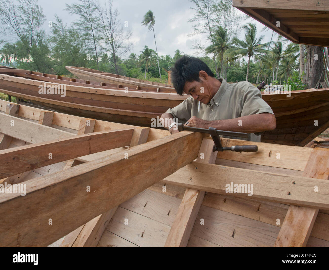 Craftsman making a fishing boat on Bintan island, Sumatra, Indonesia, Southeast Asia, Asia Stock Photo