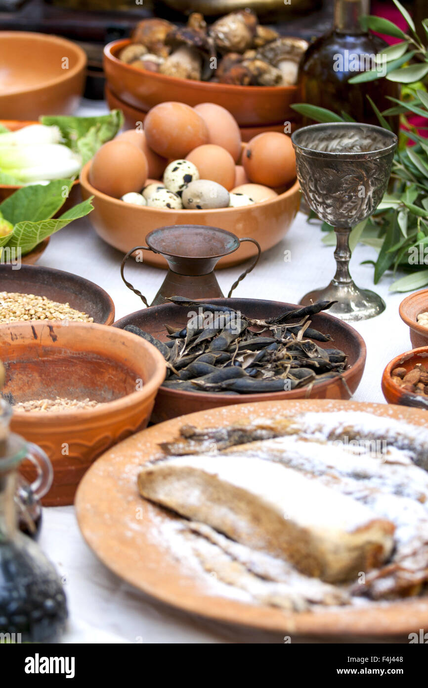 Preparing ancient Roman food - eggs, fish, beans, etc... Stock Photo