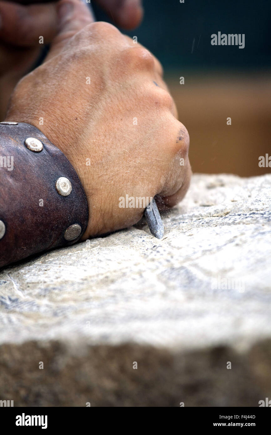 Stone carving - reconstruction of medieval stone work . Stock Photo