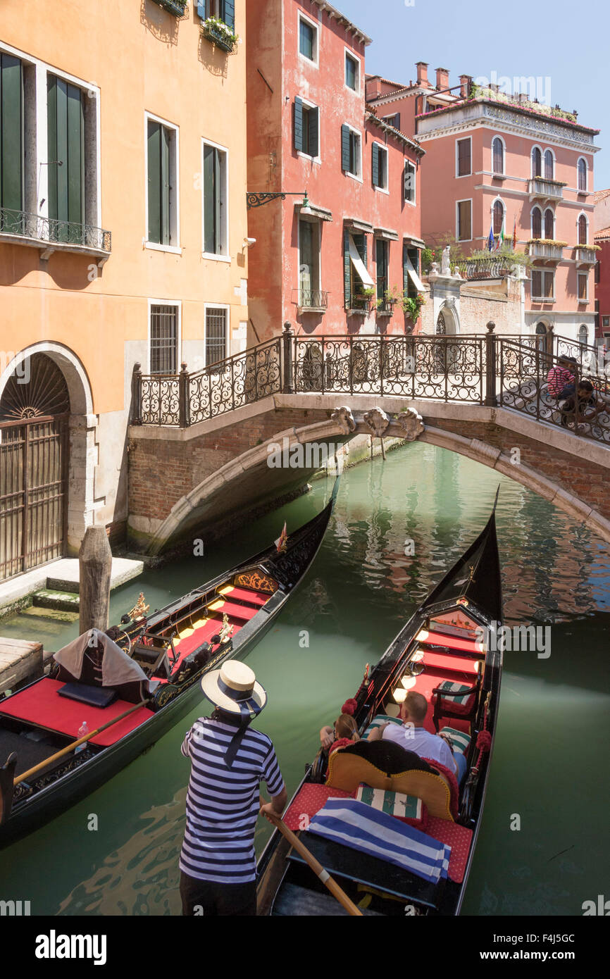 Gondola passing under a bridge over a small canal, Venice, UNESCO World Heritage Site, Veneto, Italy, Europe Stock Photo