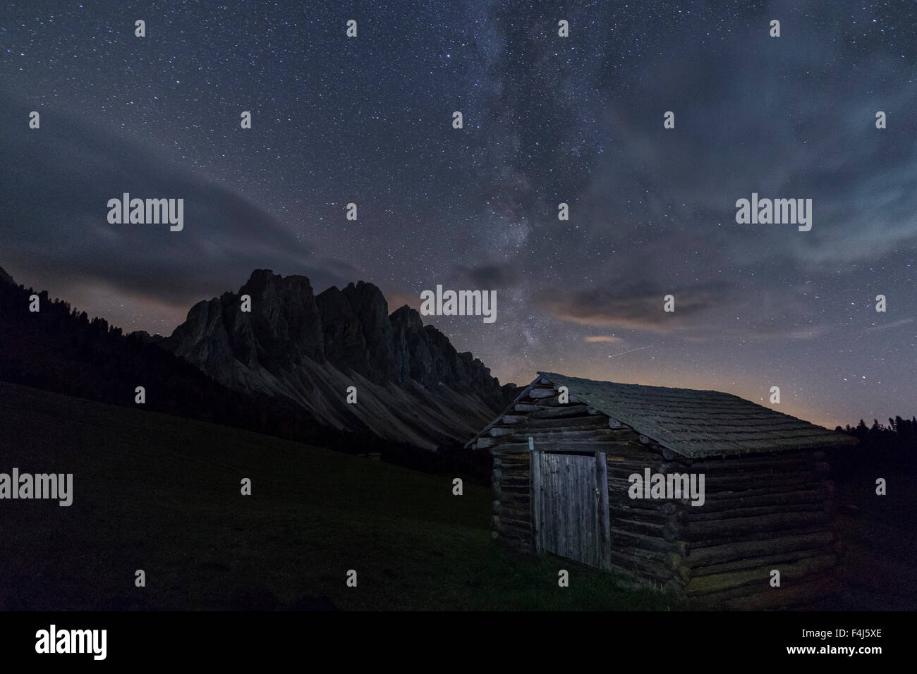 The Milky Way in the starry sky above the Odle, Funes Valley, South Tyrol, Dolomites, Italy, Europe Stock Photo