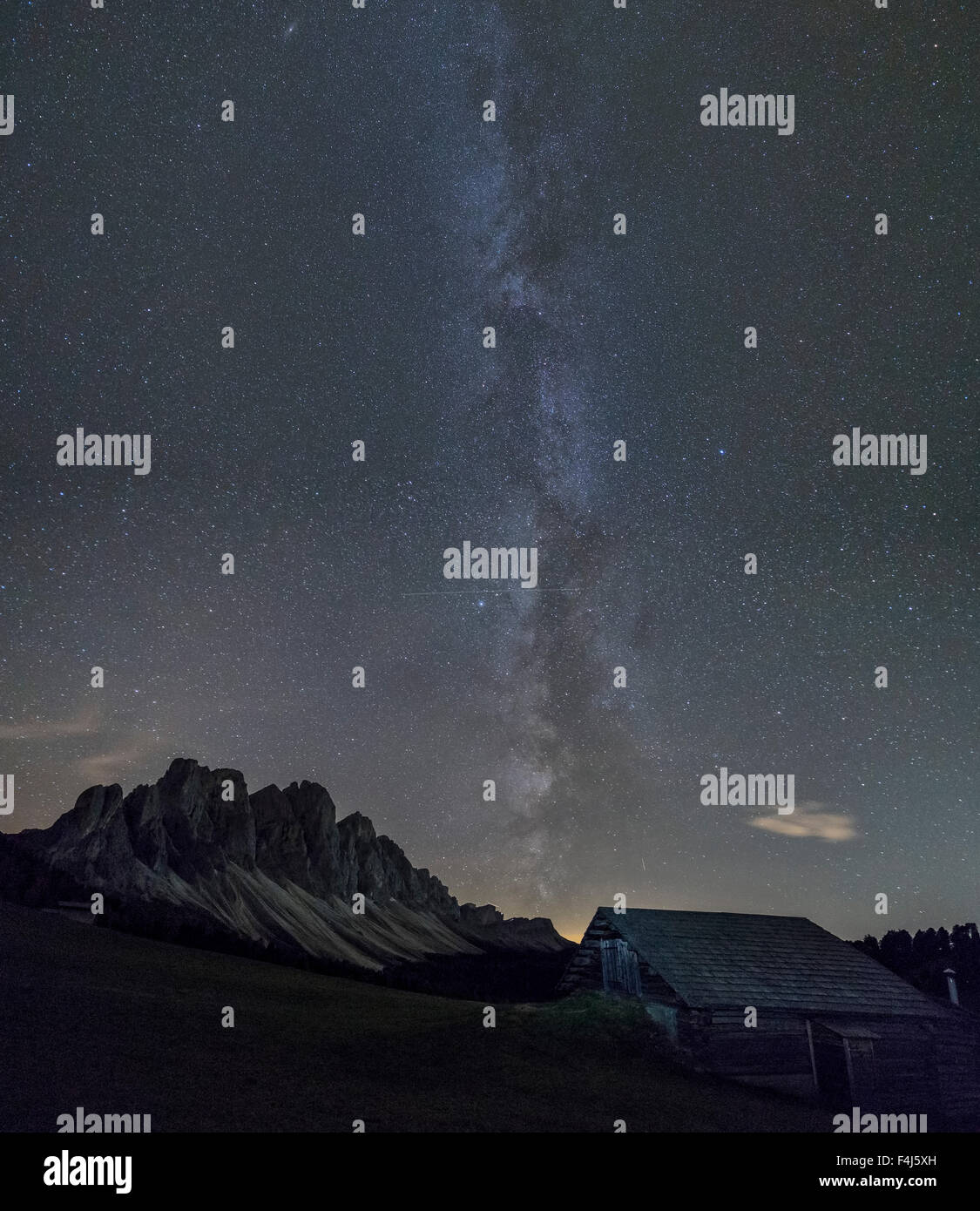 The Milky Way in the starry sky above the Odle, Funes Valley, South Tyrol, Dolomites, Italy, Europe Stock Photo