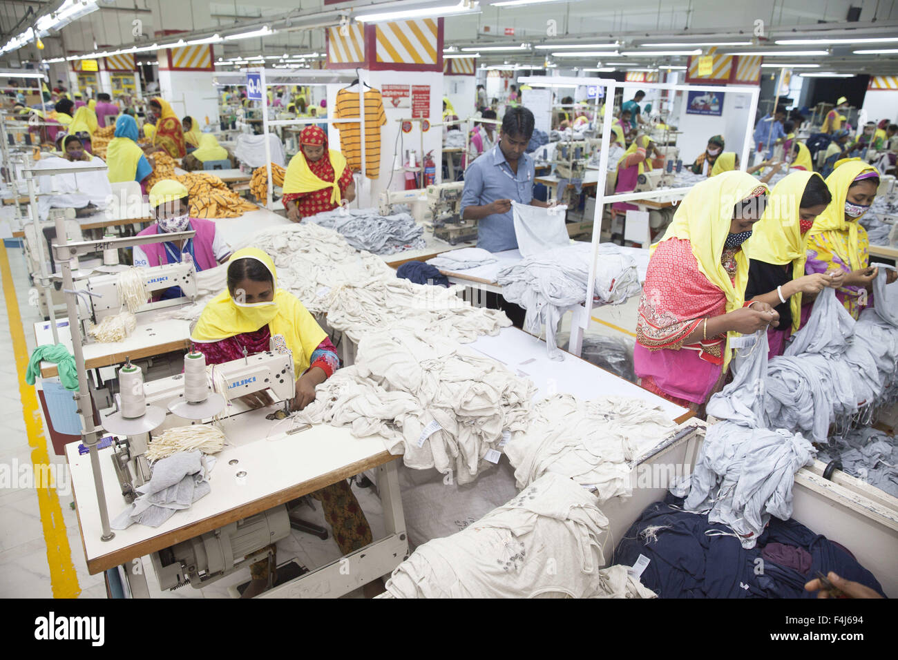 Sept. 21, 2015 - Gazipur, Dhaka, Bangladesh - Bangladeshi female workers work at a garments factory in Gazipur, near Dhaka, Bangladesh. (Credit Image: © Suvra Kanti Das via ZUMA Wire) Stock Photo