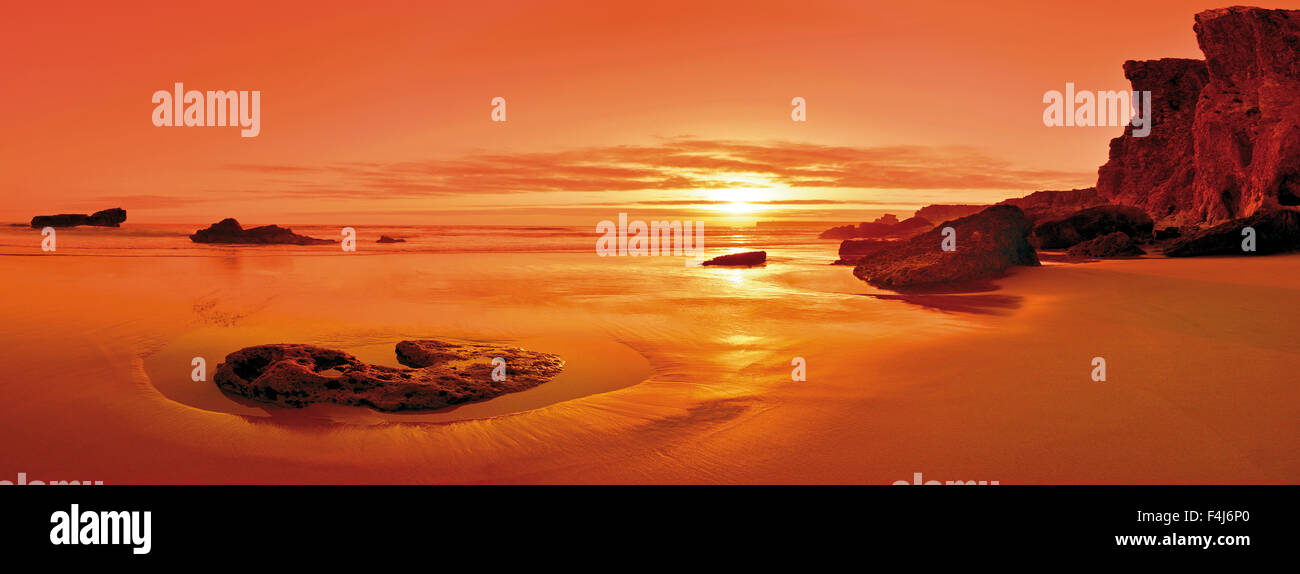 Scenic beach panorama at sunset Stock Photo