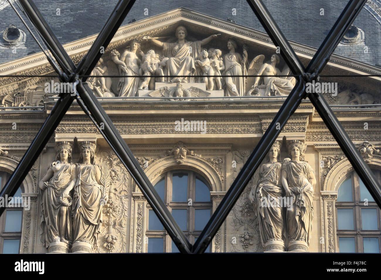 Palais du Louvre seen through the Pyramid, Paris, France, Europe Stock Photo