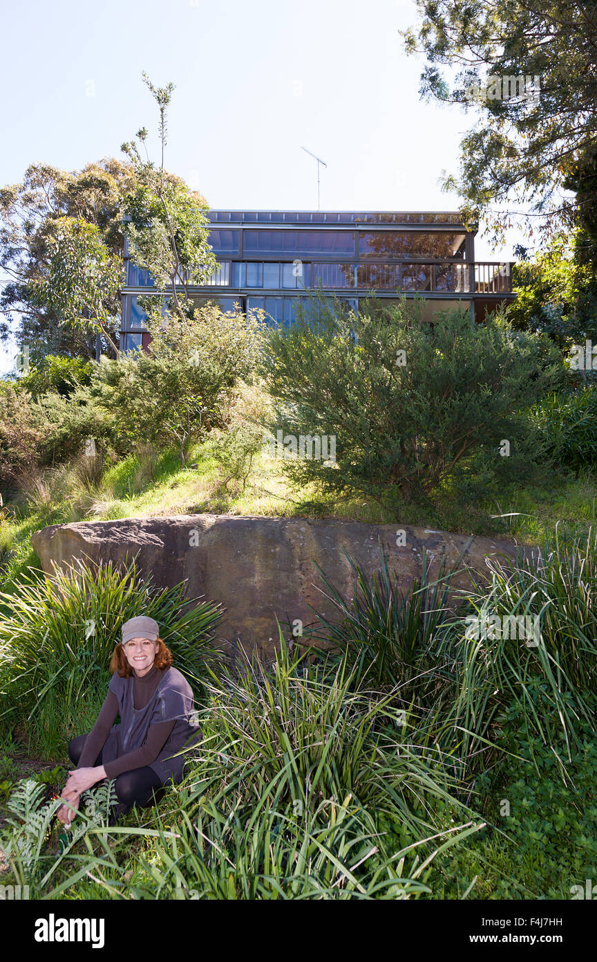 Australian artist Janet Laurence relaxing in her garden in Sydney. Stock Photo