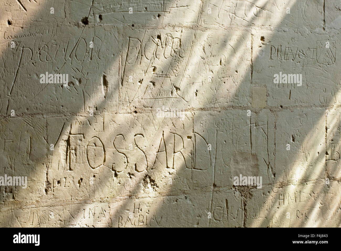 Anicent grafitti etched into the stone walls of the Chateau de Chambord, UNESCO, Loir-et-Cher, Centre, France Stock Photo