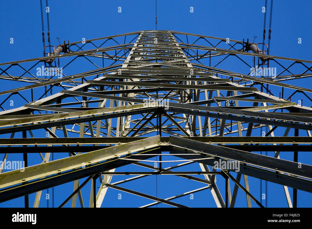 Electricity Pylons against a Blue sky Stock Photo - Alamy