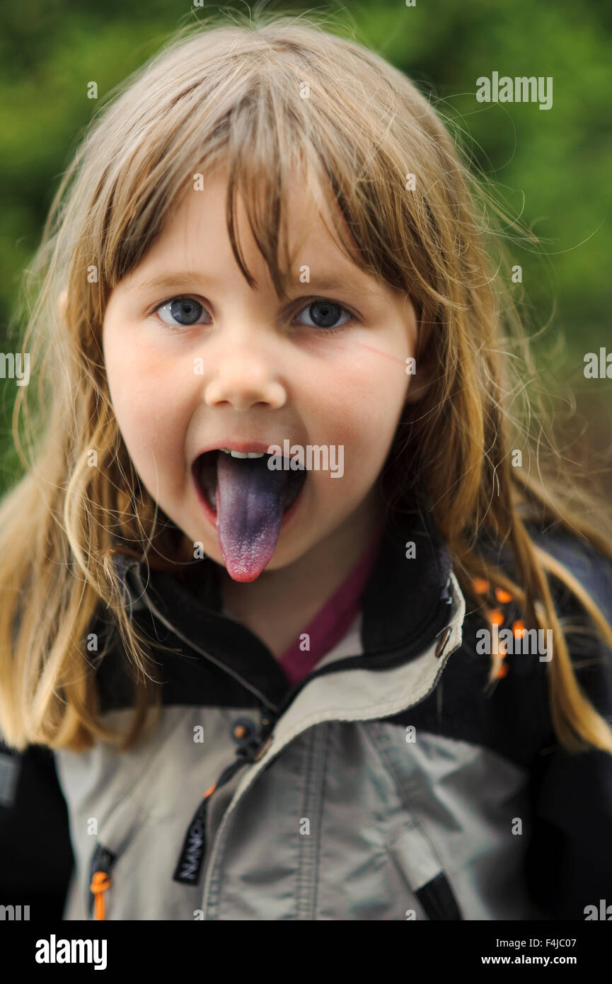 Girl with a blue tongue, Sweden. Stock Photo