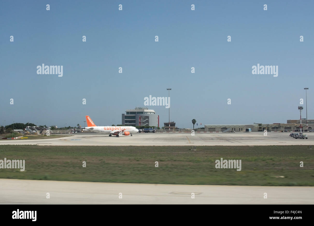 Malta Luca International airport tarmac with EasyJet airplane in the gate Stock Photo