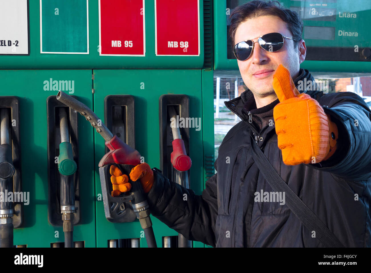 Worker at a gas station Stock Photo Alamy